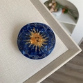 Pinza para el pelo de acetato jaspeado azul con patrón de sol dorado y artístico - Pinza de Sol Azul