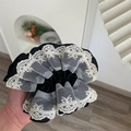 Close-up of black satin scrunchie with white floral lace and bow embroidery detail - Black Lace Scrunchie / Black