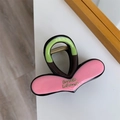 Detail van de kleurblok haarklem in roze en groen met gouden Barrette-inscriptie - Roze