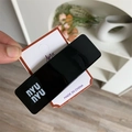 Minimalist black hair clip with white letter logo on white display card packaging - Black Square