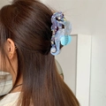 Pince à cheveux hippocampe en acétate avec finition nacrée irisée bleue et violette - Style Hippocampes Jumeaux