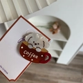 Detail showing white puppy and coffee cup design on a double-layered acrylic hair clip - Beige Puppy + Coffee Cup