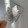 Niche shell-shaped hair claw in pearl white acetate with brown spots and black swirls - White Polka Dot Conch Style