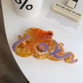 Detailed close-up of orange octopus acetate hair claw clip with colorful polka dots - Orange Large Octopus Claw