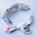 Soft cotton baby headband with pink arrows and blue hearts featuring a sweet knotted bow - Bow Twist Knot Style (DY004) / Blue Heart Pattern