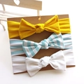 Set of 3 soft cotton baby bow headbands in yellow, striped, and white on display card - Bright Yellow Blue White Stripe White