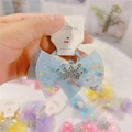 Macro shot of light blue tulle bow hair clip with sparkling rhinestone crown detail - Hair Tie / Blue