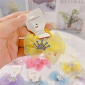 Detail of yellow mesh bow hair clip with silver rhinestone crown on branded card - Hair Tie / Yellow