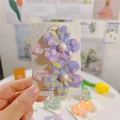 Dettaglio di fermagli per capelli a fiore in rete viola con paillettes e perle rosa - Molletta BB Viola