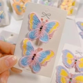 Close-up of butterfly hair clips with colorful embroidery and sparkling rhinestones - Style 10 (10#)