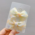 Close-up of translucent polka dot lace hair clips with gold edge detailing - Yellow Hair Clips (Pair)
