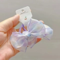 Detailed macro view of translucent organza bow hair tie with vibrant polka dot patterns - Purple Hair Rings (Pair)