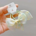 Detail of polka dot organza bow hair scrunchies with elastic band in soft pastel colors - Green Hair Rings (Pair)