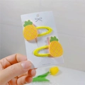 Close-up of yellow glitter pineapple hair clips for kids with green leaf details - Pineapple BB Clip