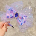 Close-up of a purple tulle bow headband with a dark blue gem and floral patterns - Headband / Purple