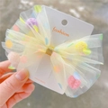 Barrette à nœud en tulle jaune pâle avec pois colorés et centre pailleté doré - Barrette Jaune