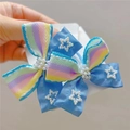 Detail of sweet blue rainbow ribbon hair tie with pearl star accents and striped textures - Sky Blue Hair Tie