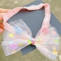 Rosa elastisches Baby-Stirnband mit großer Netzhautschleife und bunten Pastell-Pompons - Rosa Stirnband