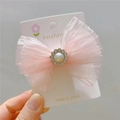 Detailed macro of pink mesh bow hair clip with faux pearl and rhinestone center decoration - Hair Clip / Pink