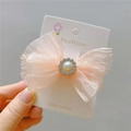 Detail of pink organza bow hair clip with central imitation pearl and rhinestone cluster - Hair Clip / Korean Pink