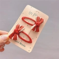 Detail of red striped handmade bow hair clips for girls on display card - Red