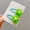 Detail of green floral pom-pom hair clips on a card for girls' hairstyles - Fruit Green BB Clip