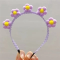 Vue détaillée du serre-tête tournesol en peluche violette pour les fêtes - Mauve Clair
