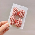 Detail of red and white gingham bow hair clips with handmade gold lettering on card - Padded Gingham Bow Duckbill Clip (Pair)