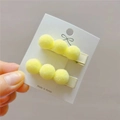 Detalle de pinzas para el cabello con pompones amarillos para niñas en cartón - Amarillo Pálido Par