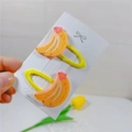 Set of two yellow banana-shaped BB hair clips for children featuring pink floral accents - Banana BB Clip