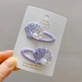Détail des pinces à cheveux en forme de coquillage pailleté violet avec perles - Pince BB Coquille Violette