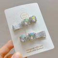 Macro detail of handmade heart hair clips with iridescent AB crystal gems and glitter finish - AB Iridescent Heart (Pair)