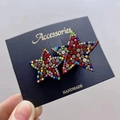 Close-up of handmade star-shaped hair accessories with colorful inlaid rhinestones - Multicolor Star Duo Hair Clip
