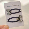 Detail view of navy blue fabric hair clips with sparkling rhinestones and bow accents - AB Rhinestone Bow Snap Clips (Pair)