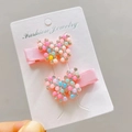 Detail of butterfly hair clips with colorful beads and rhinestones on card - Pastel Butterfly