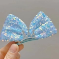 Close-up of light blue sequined bow hair clip with a silver rhinestone crown detail - Butterfly Bow Crown Style (Right) / Blue Right