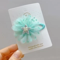 Dettaglio del fermaglio per capelli a fiore in tulle verde menta con stella di perle - Fermaglio Per Capelli In Tulle A Pois Verdi
