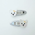 Detail of silver glitter hair clips featuring white embroidered bears with yellow bows - Embroidered Bear Pair