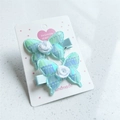 Sparkly sequin butterfly hair clips with white rose detail on elegant mint blue fabric - Lake Blue (Pair)
