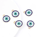 Detailed macro view of five blue enamel evil eye pendants with gold alloy metal edges - Gold