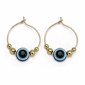 Detailed close-up of golden hoop earrings featuring blue evil eye beads and gold accents - Single Bead Gold Style (BE1374GD02)
