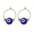 Close-up of gold hoops with blue evil eye beads and golden spacers on white background - Classic Dark Blue Eye (BE1374GD04)
