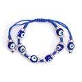 Detailed macro shot of blue woven evil eye bracelet with crystal spacers and bead ends - Dark Blue