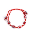 Detail of red braided Evil Eye bracelet with rhinestone spacers and adjustable cord - Red