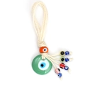 Macro shot of colorful handmade glass evil eye beads tied with natural hemp rope tassel - Green