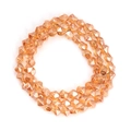 Macro detail of faceted irregular glass beads in amber orange for DIY jewelry making - Amber Orange Faceted Style (BT753GD07) / 1 Strand (Approx. 82 Pcs)