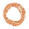 Close-up of faceted amber glass beads with reflective surfaces for DIY jewelry making - Amber (BT751GD08)