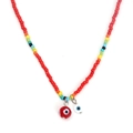 Detailed close-up of Bohemian colorful beads necklace with red evil eye charms on white base - Red Double Eye Style (BE1422RD00)
