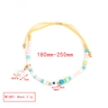 Detail showing an adjustable evil eye beaded bracelet with yellow woven cord and pearl - Yellow Rope Artificial Pearl Pendant Style (BE1427MI04)