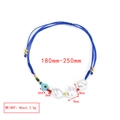 Detailed close-up of adjustable blue woven evil eye bracelet with white baroque pearls - Blue Rope Three Artificial Pearls Style (BE1427MI08)